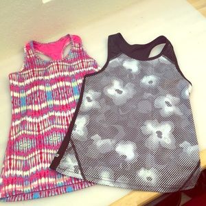 2 tank tops. One black, other pink